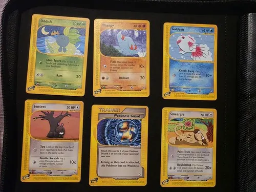 A binder page holding six e-Reader era cards, including Oddish and Smeargle.