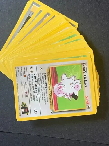 A fanned-out stack of yellow-bordered Gym-era cards, an Erika's Clefairy on top.