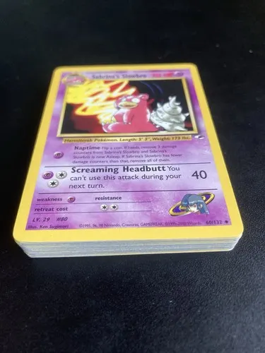 A thick stack of Gym-era cards seen from the side, a Sabrina's Slowbro on top.