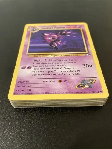 A thick stack of cards seen from the side, a Sabrina's Haunter on top.