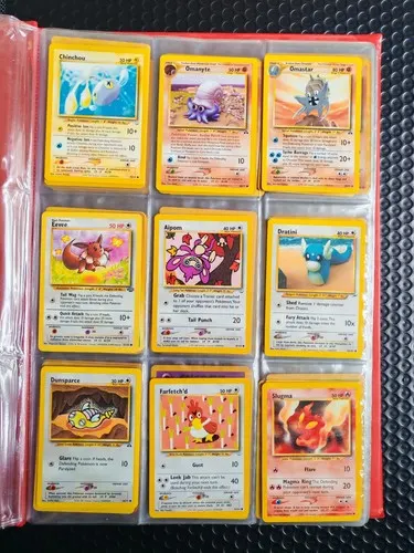 A binder page holding nine Neo-era cards, including Omastar, Aipom and Dratini.