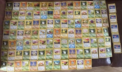 Over a hundred cards laid out in a large grid with a further column stacked to one side.