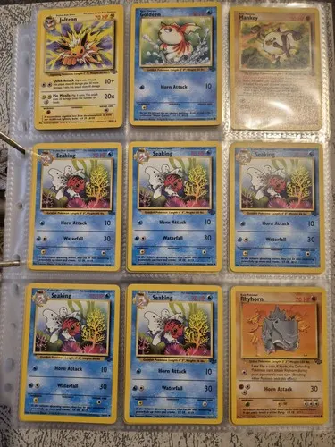 A binder page holding nine cards including a Jolteon, a Goldeen and five Seaking.