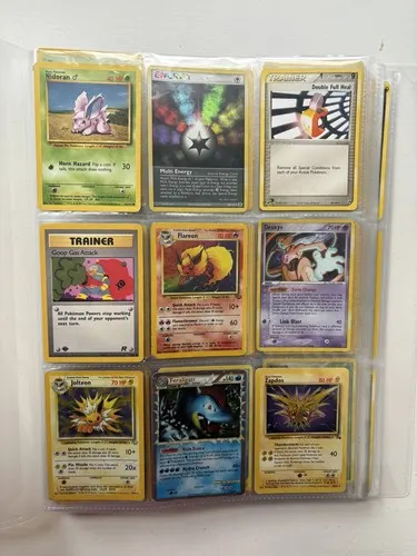 A binder page holding nine cards including a Flareon, a Jolteon and a Zapdos.